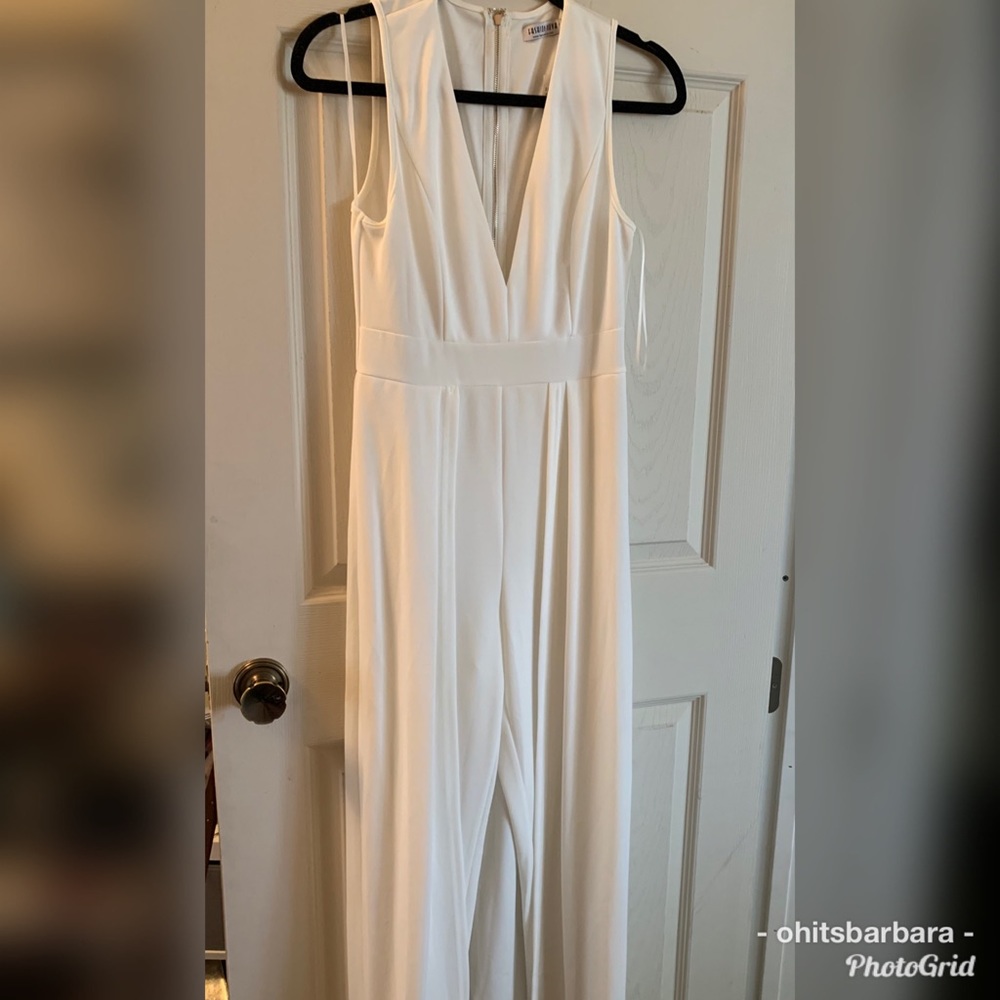 White fashion nova jumpsuit with cape. Size M.